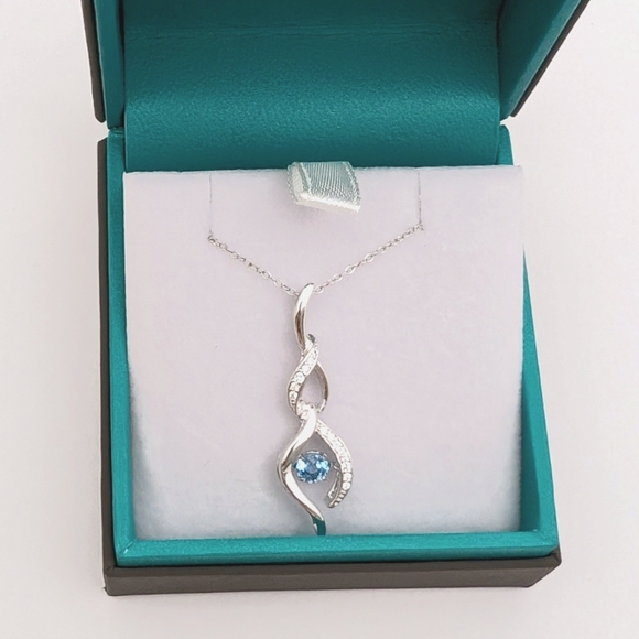Sterling Silver Round Cut Sparkling Blue Topaz Infinity Pendant Necklace - Picture 1 of 9